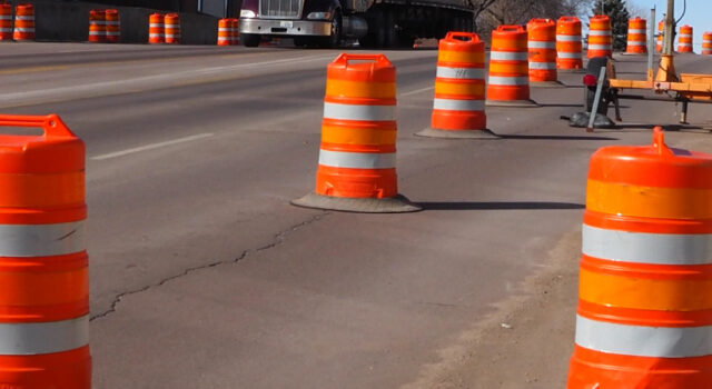 orange barrels on road